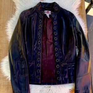 Faux leather jacket with grommet closure